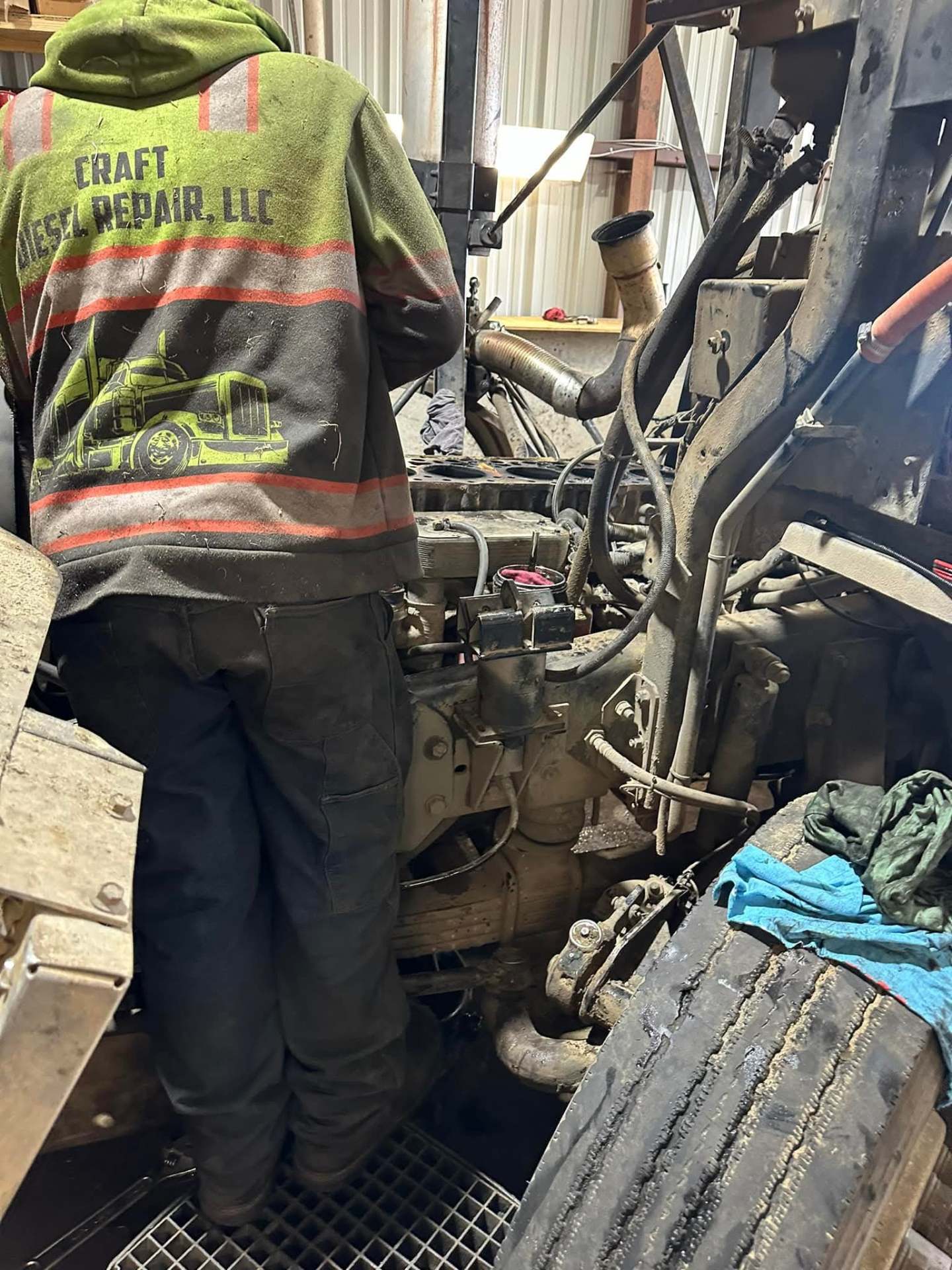 Craft Diesel Repair LLC mechanic working on a heavy truck engine